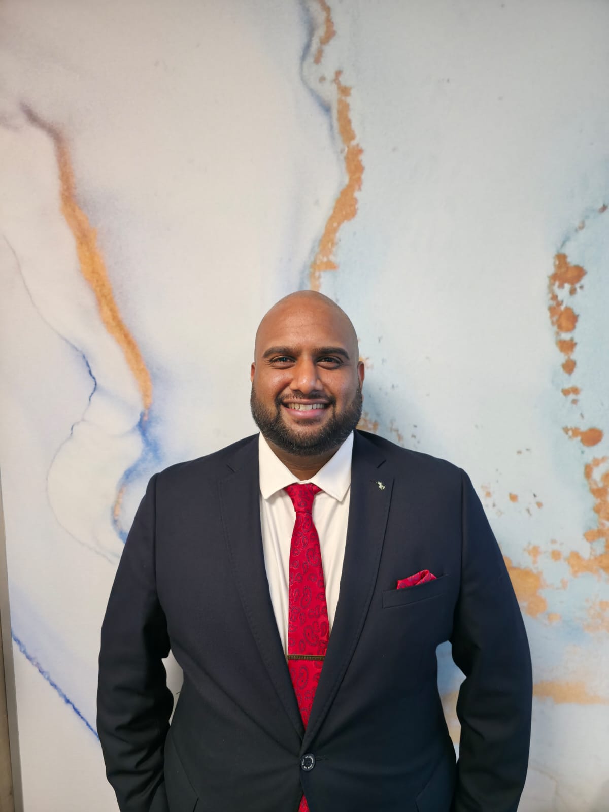 Dr. Amara Okafor examining soil samples in field research